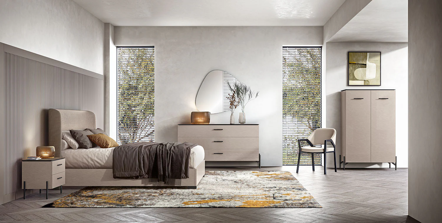 Minimalist bedroom featuring taupe upholstered bed, matching nightstand, dresser with oval mirror, and high storage cabinet